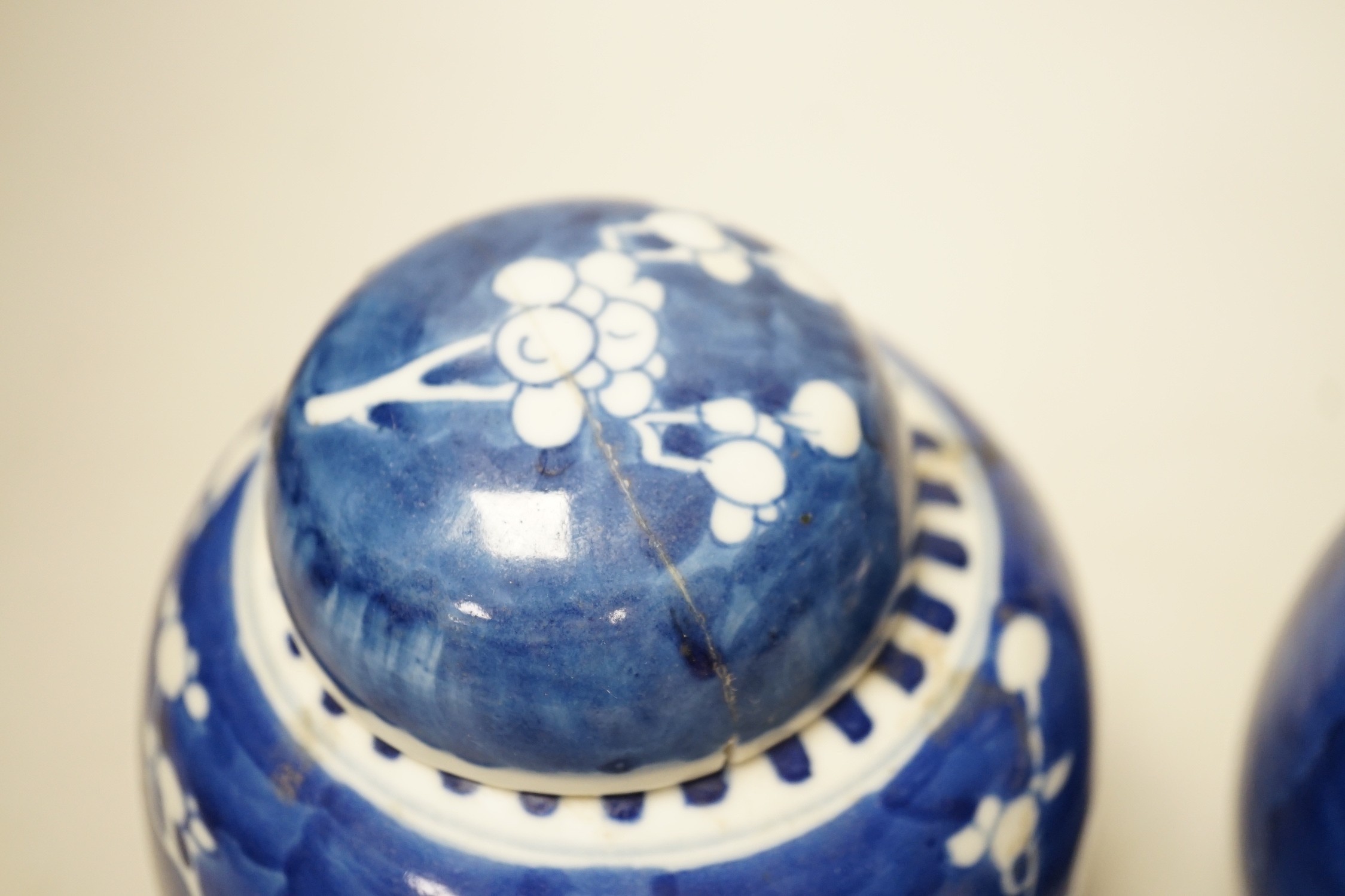A pair of Chinese Blue and white prunus ginger jars. 15cm tall